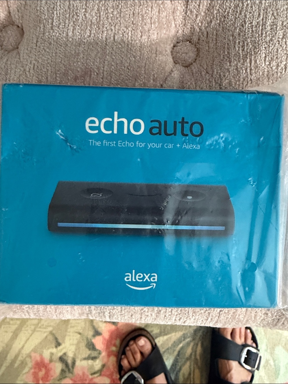 Echo Auto Car Adapter in Teal Packaging with Black Device Image
